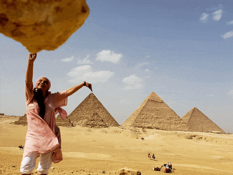 A person posing at ThePyramids of Giza