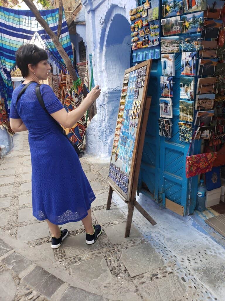 Traveler in front of a souvenir shop in Chefchaouen, Morocco