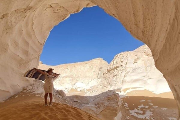 A person posing at the white desert, Egypt