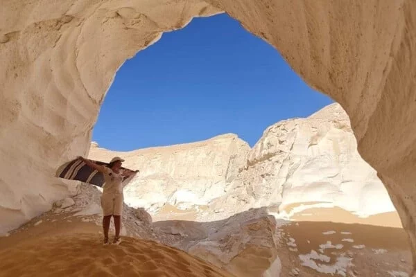 A person posing at the white desert, Egypt