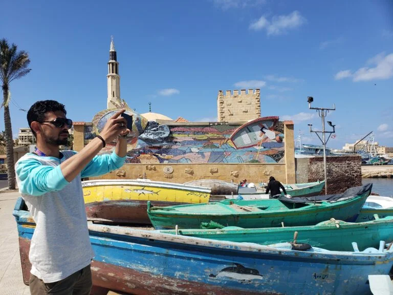 A person taking a photo in Alexandria Egypt