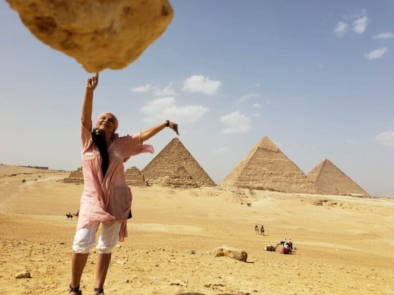 Person posing for photos at Pyramids of Giza