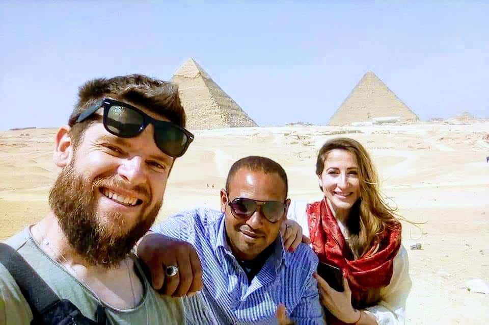 Travelers at Giza Pyramids Complex in Egypt