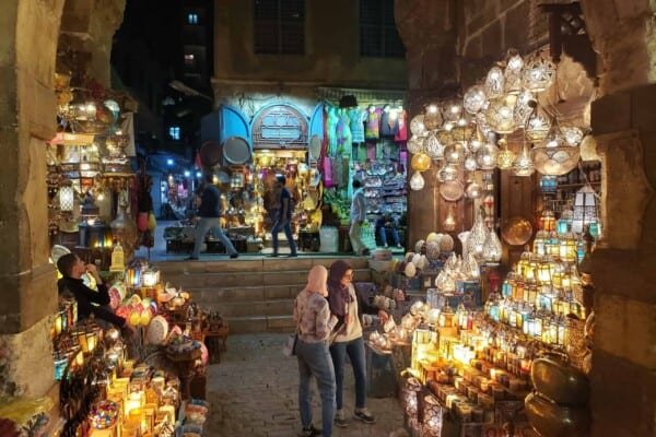 Two local girls shopping at Khan El Khalili Bazaar lamp shop