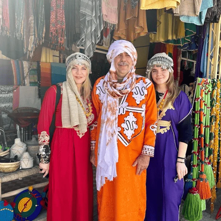 Three tourists dressed in Moroccan attire
