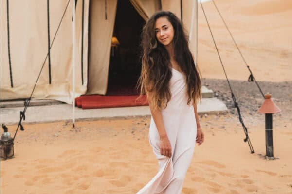 A woman posing Agafay Desert tent