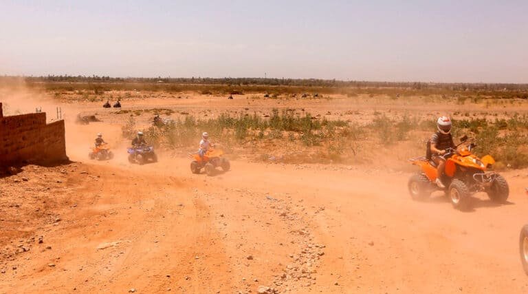 4 people riding quad bikes at Marrakech Palmeraie, Morocco